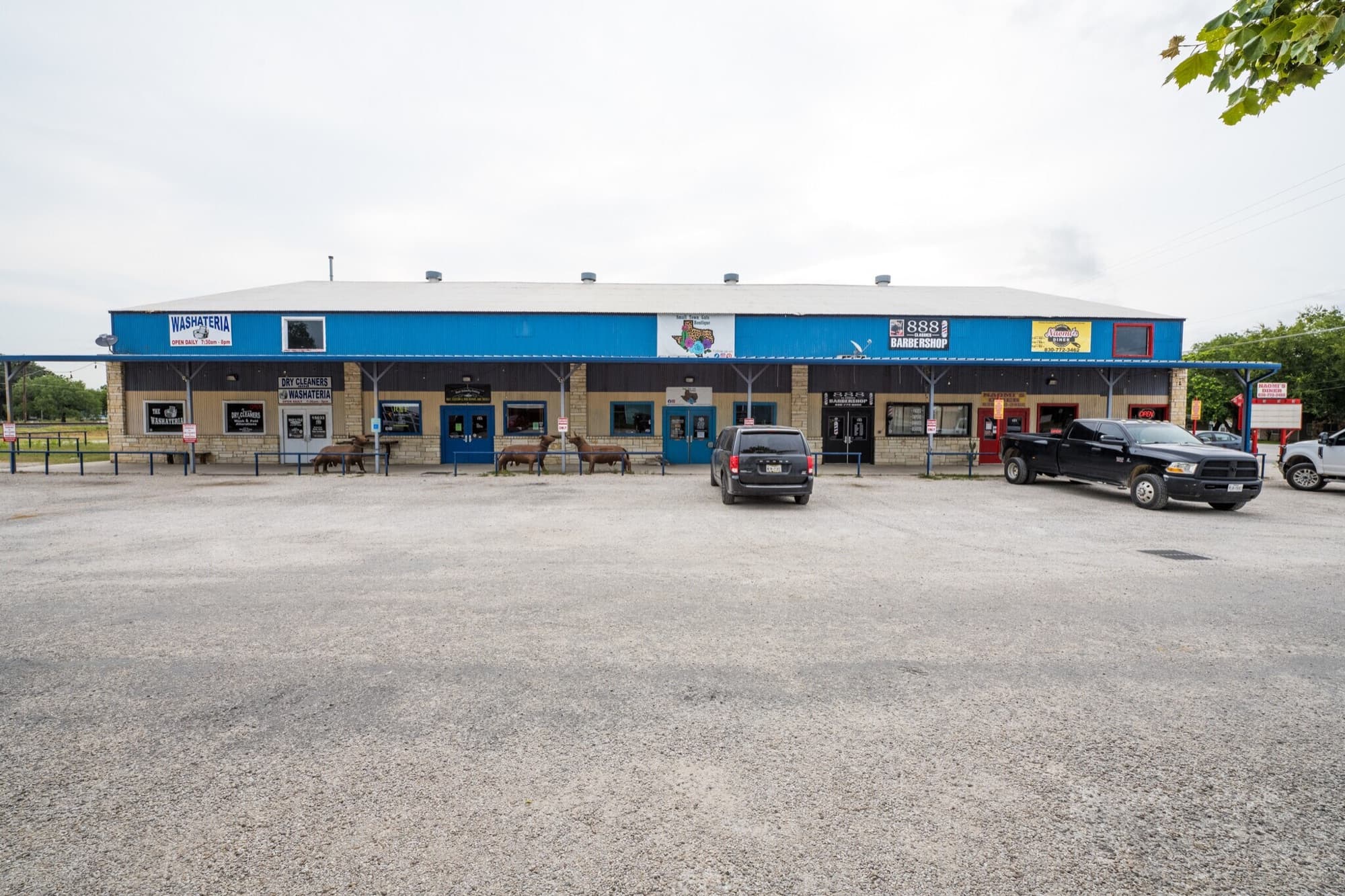 Wide front-on view of the 15033 Main St retail strip in Lytle, TX