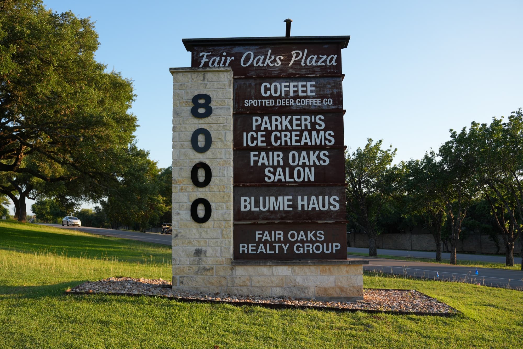 Fair Oaks Plaza 8000 monument sign listing tenants — Spotted Deer Coffee, Parker's Ice Creams, Fair Oaks Salon, Blume Haus, Fair Oaks Realty Group